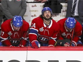 Canadiens, from left, Corey Perry, Josh Anderson, Phillip Danault and Brendan Gallagher sit out the last seconds of their loss to the Tampa Bay Lightning in Game 3 of the Stanley Cup Final in Montreal on Friday, July 2, 2021.