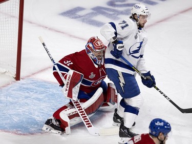 Tampa Bay Lightning centre Anthony Cirelli (71) screens Canadiens goaltender Carey Price just enough to allow the Tampa Bay Lightning to score their second goal  during Game 3 of the Stanley Cup Final in Montreal on Friday, July 2, 2021.