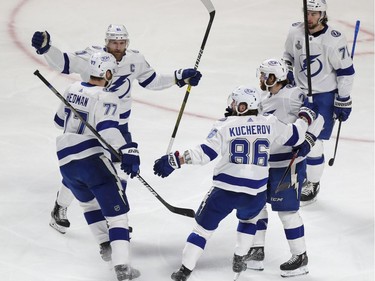 Tampa Bay Lightning players celebrate with defenceman Victor Hedman after his goal during the first period of Game 3 of the Stanley Cup Final against the Canadiens in Montreal on Friday. July 2, 2021.