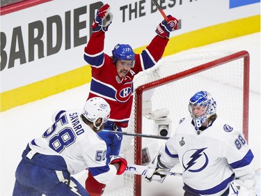 Canadiens' Brendan Gallagher celebrates linemate Phillip Danault's goal past Tampa Bay Lightning goalie Andrei Vasilevskiy and defenceman David Savard during the first period of Game 3 of the Stanley Cup Final in Montreal on Friday, July 2, 2021.