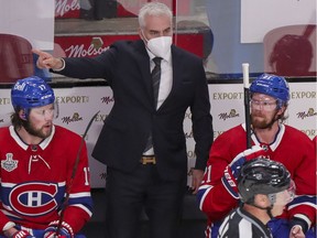 Montreal Canadiens interim head coach Dominique Ducharme yells at officials behind the bench during first period of Stanley Cup finals game against the Tampa Bay Lightning in Montreal Friday July 2, 2021.
