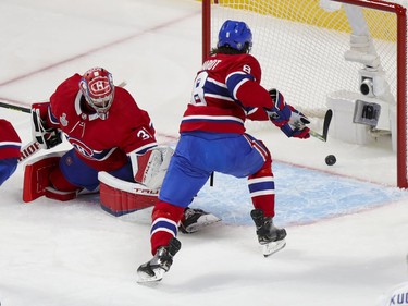 Canadiens defenceman Ben Chiarot tries to reach the puck as shot by Tampa Bay Lightning Victor Hedman trickles past goalie Carey Price for a goal during the first period of Game 3 of the Stanley Cup Final in Montreal on Friday, July 2, 2021.