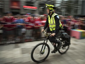 Police patrol near Montreal Canadiens fans outside the Bell Centre July 5, 2021.