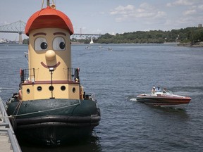 Theodore Tugboat looks at other boats cruising next to him from his berth in the Old Port during his one-day stopover in Montreal on July 5, 2021.