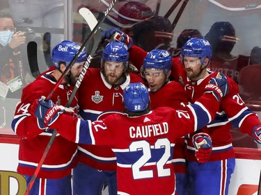Montreal Canadiens right wing Josh Anderson (17), second from left, celebrates his goal with teammates Joel Edmundson, left, Cole Caufield, Nick Suzuki and Jeff Petry, right, during the first period of Game 4 of the Stanley Cup final against the Tampa Bay Lightning in Montreal on Monday, July 5, 2021.