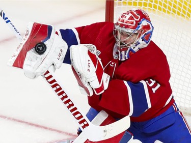 Montreal Canadiens goaltender Carey Price (31) makes a blocker save during the third period of Game 4 of the Stanley Cup final against the Tampa Bay Lightning in Montreal on Monday, July 5, 2021.