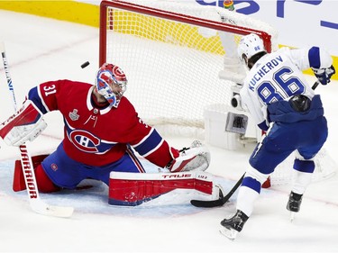 Lightning's Nikita Kucherov fires puck wide of the net behind Canadiens goaltender Carey Price during the third period of Game 4 of the Stanley Cup final Monday night at the Bell Centre.
