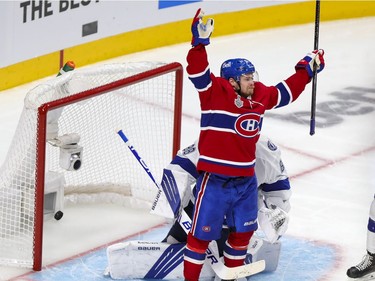 Montreal Canadiens Artturi Lehkonen celebrates goal by teammate Alexander Romanov in front of Tampa Bay Lightning goaltender Andrei Vasilevskiy during the third period of Game 4 of the Stanley Cup final in Montreal on Monday, July 5, 2021.