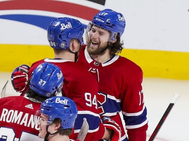 Montreal Canadiens Josh Anderson celebrates his game-winning goal with teammates Corey Perry and Alexander Romanov during overtime of Game 4 of the Stanley Cup final against the Tampa Bay Lightning in Montreal on Monday, July 5, 2021.