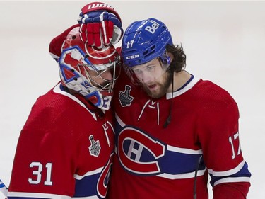 Montreal Canadiens Josh Anderson celebrates his game-winning goal with goalie Carey Price during overtime of Game 4 of the Stanley Cup final against the Tampa Bay Lightning in Montreal on Monday, July 5, 2021.