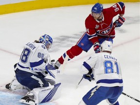 Tampa Bay Lightning's Andrei Vasilevskiy makes a save on shot by Montreal Canadiens' Corey Perry while defenceman Erik Cernak watches during first period of Game 4 in Montreal on July 5, 2021.