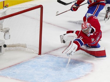 Montreal Canadiens goaltender Carey Price (31) dives in a vain attempt to stop a goal by Tampa Bay Lightning left wing (19) Barclay Goodrow during the second period of Game 4 of the Stanley Cup final in Montreal on Monday, July 5, 2021.