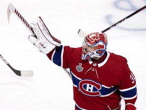 Canadiens goalie Carey Price points toward his family sitting in the stands at the Bell Centre following a 3-2 overtime victory over the Tampa Bay Lightning in Game 4 of the Stanley Cup final Monday July 5, 2021.