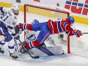 Montreal Canadiens right wing Josh Anderson (17) flies across Tampa Bay Lightning goaltender Andrei Vasilevskiy's (88) crease while being chased by defenceman Erik Cernak (81) during the second period of Game 4 of the Stanley Cup final in Montreal on Monday, July 5, 2021.