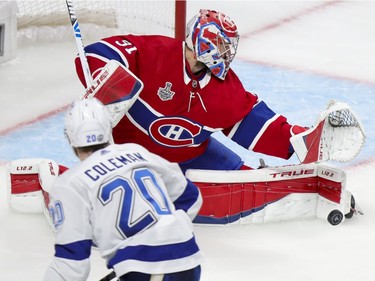 Montreal Canadiens goaltender Carey Price (31) makes a pad save as Tampa Bay Lightning right wing Blake Coleman (20) looks for the rebound during the second period of Game 4 of the Stanley Cup final in Montreal on Monday, July 5, 2021.