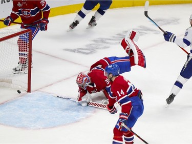 Tampa Bay Lightning Barclay Goodrow (19) scores a goal against the Montreal Canadiens  during the second period of Game 4 of the Stanley Cup final in Montreal on Monday, July 5, 2021.