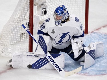 Tampa Bay Lightning goaltender Andrei Vasilevskiy (88) makes a save against the Montreal Canadiens during Game 4 of the Stanley Cup final in Montreal on Monday, July 5, 2021.