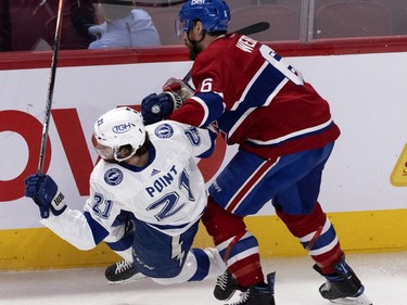 Montreal Canadiens defenceman Shea Weber (6) delivers a big hit to open Tampa Bay Lightning centre Brayden Point (21) during Game 4 of the Stanley Cup final in Montreal on Monday, July 5, 2021.