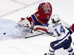 Lightning left wing Pat Maroon beats Canadiens goaltender Carey Price to tie the game 2-2 during Game 4 on Monday. The goal came with defencemen Jeff Petry and Ben Chiarot in the penalty box waiting for a whistle so they could return to the game.