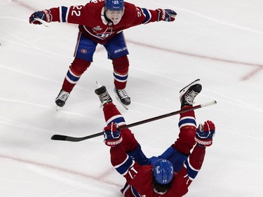 Montreal Canadiens right wing Cole Caufield (22) celebrates with Canadiens right wing Josh Anderson (17) after Anderson scored the winning goal in overtime against the Tampa Bay Lightning during Game 4 of the Stanley Cup final in Montreal on Monday, July 5, 2021.