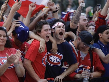 Montreal Canadiens fans celebrate a first-period goal by Josh Anderson during Game 4 of the Stanley Cup final outside the Bell Centre on Monday, July 5, 2021.