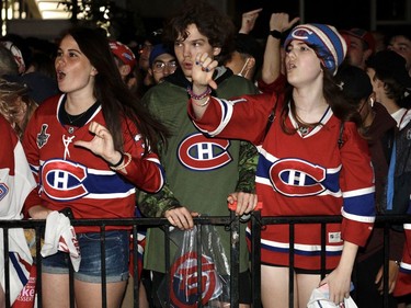 Montreal Canadiens fans react to a tying goal by the Tampa Bay Lightning during Game 4 of the Stanley Cup final outside the Bell Centre on Monday, July 5, 2021.