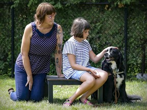 Jennifer McNamara with daughter Olivia and Olivia's support dog Momo at their home in Ste-Marthe-sur-le-Lac.