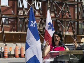 Montreal mayor Valérie Plante speaks to reporters in front of a building being converted into the new shelter for Indigenous women on Monday July 12, 2021.