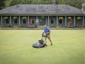 Chris Morrin closely mows the lawn at the Westmount bowling lawn on July 13, 2021.