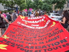 Montrealers took to the streets in Montreal on Sunday July 18, 2021 in support of "Status for All", a call for permanent residency for temporary migrant workers and their families who live in Canada.