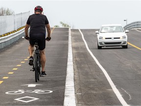 The Ministere des Transports announced the opening of the new Chemin des Chenaux overpass over Highway 40 in Vaudreuil-Dorion on July 15. Cyclists and drivers alike safely take the overpass in Vaudreuil-Dorion on Saturday.