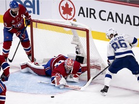 Canadiens goaltender Carey Price manages to stop Lightning's Nikita Kucherov as Canadiens defenceman Shea Weber looks on during Game 3 of the Stanley Cup final earlier this month at the Bell Centre.