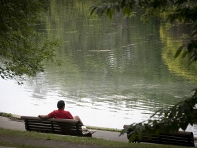 Taking time to relax on bench at Lafontaine Park on July 22, 2021.