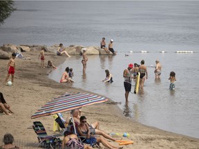 With the annual construction holidays on, people enjoy a sparkly populated Verdun Beach as they try to beat the heat in Montreal on July 26, 2021.