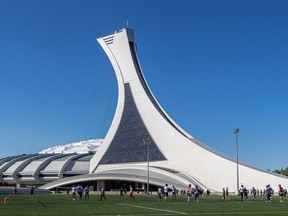 The Montreal Alouettes practice in the shadow of the Olympic Stadium in Montreal on July 28, 2021.