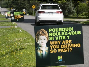 Beaconsfield has approved some new traffic calming measures. Pictured are signs posted last year that implore drivers to slow down.