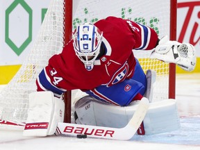 Montreal Canadiens' Jake Allen controls a long Winnipeg Jets shot during second period in Montreal on April 8, 2021.