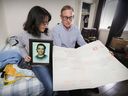 Riley Fairholm's parents, Tracy Wing and Larry Fairholm, look at a card sent by their son's friends after he was killed in 2018. The family's lawsuit seeks more than $700,000 in damages for Fairholm’s parents and sisters, including $100,000 in punitive damages from the officer who shot the 17-year-old.