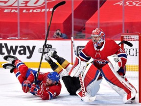 Knights' Reilly Smith collides with Canadiens' Shea Weber, while goalie Carey Price focuses on the puck during the teams' semifinal series in June.