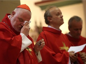 German Cardinal Reinhard Marx wipes his brow as he attends an evening Mass service led by Cardinal Secretary of State of the Vatican Pietro Parolin at Saint Johannes Basilika (Basilica of St. John the Baptist) on June 29, 2021, in Berlin. Germany and the Vatican are celebrating the 100th anniversary of diplomatic relations. The anniversary comes at a time of crisis for the Catholic Church in Germany, with relevant issues including the Church's handling of sex abuse cases by priests in the Cologne Archdiocese, a growing movement within the Church to recognize gay marriage, the demand for women clergy and the mass exodus of Catholic Church members over the last decade.