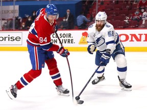 David Savard of the Tampa Bay Lightning defends against Corey Perry of the Montreal Canadiens during the second period of Game 3 of the 2021 NHL Stanley Cup finals at the Bell Centre on July 2, 2021, in Montreal.
