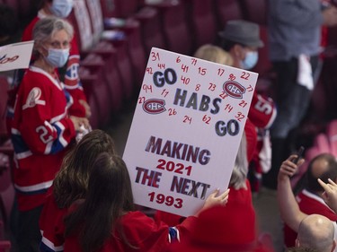 Habs fans cheer during the pregame skate during Game 3 of the Stanley Cup Final between the Canadiens and the Tampa Bay Lightning in Montreal on Friday, July 2, 2021.