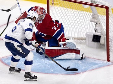 Tampa Bay Lightning's Nikita Kucherov (86) lifts the puck over Canadiens goaltender Carey Price (31) during Game 3 of the Stanley Cup Final in Montreal on Friday, July 2, 2021.
