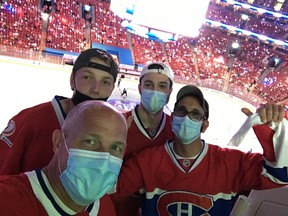 Canadiens fan Derek Parker (bottom left) and his nephew Brandon (above him) attended Game 3 of Stanley Cup Final at the Bell Centre along with friends Robert Porco (bottom right) and his son Justin. Parker got the four tickets in a lottery for Canadiens season-ticket holders at a cost of $900 each.