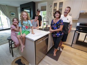 A life shared: Shannon Gault and Andrew Wilkins, rear, and their children Aubrey, left, and Duncan, with Shannon's parents Hugh and Marie Gault in their intergenerational home in Hudson.