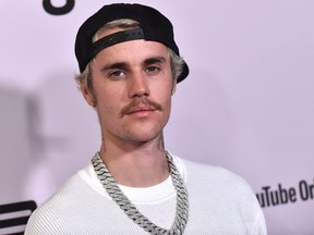 FILE: Canadian singer Justin Bieber arrives for YouTube Originals' "Justin Bieber: Seasons" premiere at the Regency Bruin Theatre in Los Angeles on Jan. 27, 2020. /