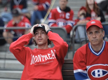 Canadiens fans react to a first period goal by the Tampa Bay Lightning at Place des Festivals in Montreal on Friday, July 2, 2021, during Game 3 of the Stanley Cup Final in Montreal.