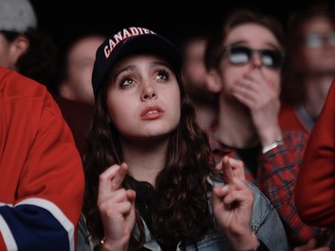 A Canadiens fan crosses her fingers hoping for a third-period comeback in Game 3 of the Stanley Cup Final at the Bell Centre in Montreal 
on Friday, July 2, 2021.