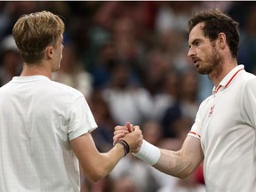 Canada's Denis Shapovalov, left, greets Britain's Andy Murray after winning their men's singles third round match on the fifth day of the 2021 Wimbledon Championships at The All England Tennis Club in Wimbledon, southwest London, on Friday, July 2, 2021.