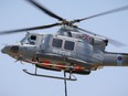 A handout picture released by the British Forces in Cyprus on July 4, 2021, shows a British Royal Air Force Griffin HAR2 Bell helicopter taking off from the Sovereign Base Area (SBA) of Akrotiri, a British overseas territory located 10 kilometres west of the southern Cypriot port city of Limassol, to help extinguish a massive fire raging on the slopes of the Troodos mountain range on the Mediterranean island of Cyprus.